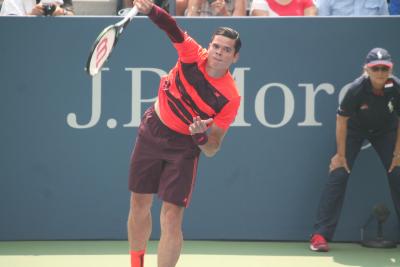 Canadian Milos Raonic held off an inspired comeback from fourth-seed and former champion Stan Wawrinka on Monday beating the Swiss 6-4 6-3 5-7 4-6 6-3 to reach the Australian Open quarterfinals for the second straight year