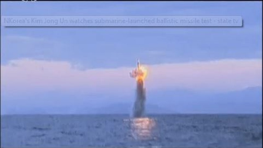 Korea's Kim Jong watches submarine launch ballistic missile test