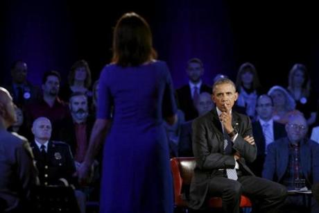 President Obama listened as Taya Kyle asked him about murder rates during Thursday’s town hall event hosted by CNN