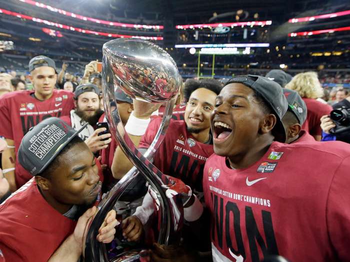 Television ratings for the first College Football Playoff semifinals held on New Year's Eve dropped approximately 36 percent from last season when they were played on New Year's Day. Associated Press