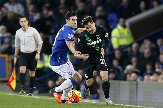 Stoke City's Bojan Krkic, right and Everton's Gareth Barry vie for the ball during the English Premier League match between Everton and Stoke City at Goodison Park in Liverpool England Monday Dec. 28 2015. UNITED KINGDOM OU