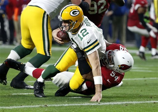 Green Bay Packers quarterback Aaron Rodgers is sacked by Arizona Cardinals inside linebacker Dwight Freeney during the second half of an NFL football game in Glendale Ariz. Three weeks ago the Arizona Card