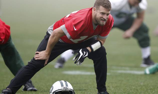 New York Jets quarterback Ryan Fitzpatrick stretches during NFL football practice Wednesday Dec. 30 2015 in Florham Park N.J. The Jets are preparing for Sunday's game against the Buffalo Bills and their former coach Rex Ryan. If they defea