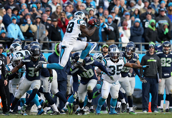 CHARLOTTE NC- JANUARY 17  Thomas Davis #58 of the Carolina Panthers recovers the Seattle Seahawks onside kick in the 4th quarter during the NFC Divisional Playoff Game at Bank of America Stadium