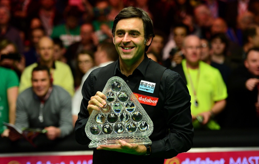 LONDON ENGLAND- JANUARY 17 Ronnie O'Sullivan of England poses with the Dafabet Masters Trophy after defeating Barry Hawkins of England in the final match during Day Eight of The Dafabet Masters at Alexandra Palace