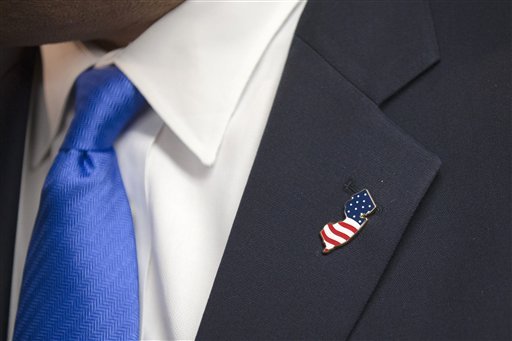 Republican presidential candidate New Jersey Gov. Chris Christie wears a New Jersey-shaped pin during a town hall style campaign stop Wednesday Jan. 13 2016 at Pinardville Fire Station in Manchester N.H