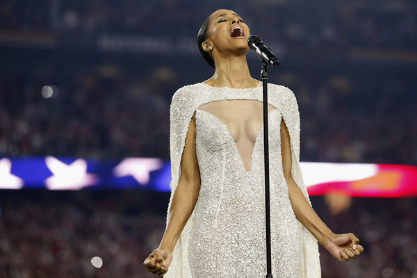 Singer Ciara sings the national anthem prior to the start of the 2016 College Football Playoff National Championship Game between the Alabama Crimson Tide and the Clemson Tigers at University of Phoenix Stadium