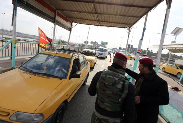 Iraqi security forces at a checkpoint in southern Baghdad where the kidnapping occurred