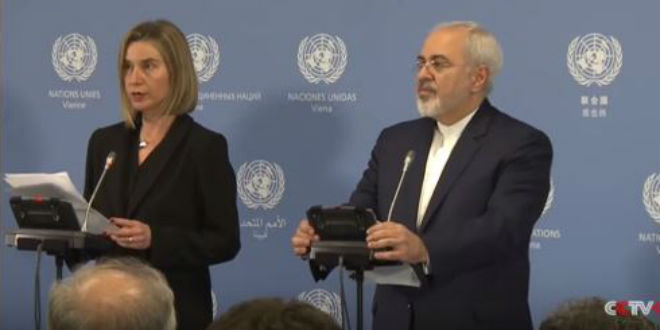 EU High Representative Federica Mogherini and Iranian Foreign Minister Mohammed Zarif announce the implementation of the Iranian nuclear deal