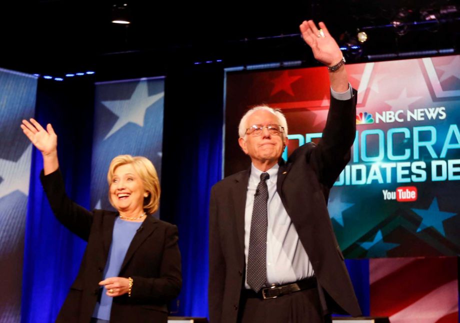 Democratic presidential candidates Hillary Clinton and Sen. Bernie Sanders I-Vt stand together before the start of the NBC You Tube Democratic presidential debate at the Gaillard Center in Charleston S.C. The Demo