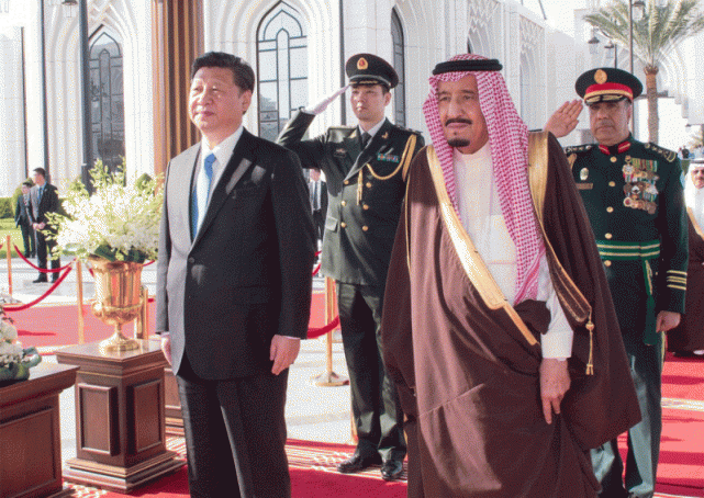 Saudi King Salman stands next to Chinese President Xi Jinping during a welcoming ceremony