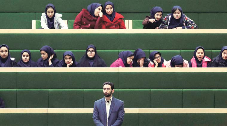 School girls follow the address of President Hassan Rouhani in Parliament Tehran on Sunday