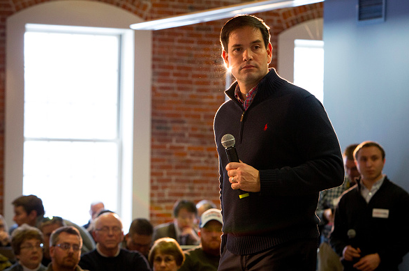 Senator Marco Rubio a Republican from Florida and 2016 presidential candidate listens to a question during a town hall meeting at the Maytag Innovation Center in Newton Iowa U.S. on Wednesday Dec. 30 2015. Rubio found himself under siege on two fro