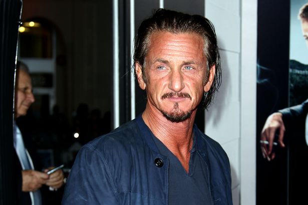 Sean Penn gets ready to enter the famous Grauman's Chinese Theater in LA