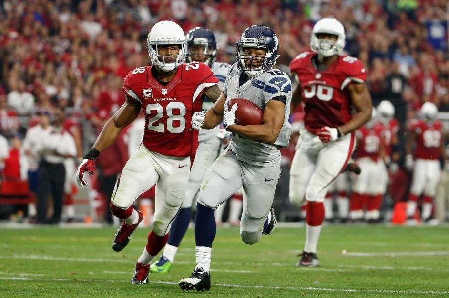 GLENDALE AZ- JANUARY 03 Wide receiver Tyler Lockett #16 of the Seattle Seahawks runs with the football in the first half of the NFL game against the Arizona Cardinals at the University of Phoenix Stadium