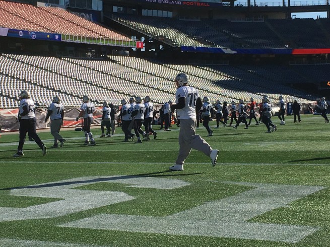 Sebastian Vollmer jogs as he warms up for practice inside Gillette Stadium Thursday