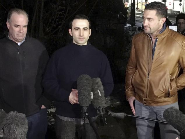 Amir Hekmati, flanked by U.S. Congressman Dan Kildee and brother-in-law Ramy Kurdi speaks with media in Landstuhl Germany on Tuesday for the first time since his release