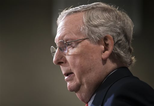 Senate Majority Leader Mitch McConnell R-Ky. speaks with reporters at the Capitol in Washington. McConnell R-Ky. urged his colleagues to vote Wednesday Jan. 20 to move ahead on a House-passed bill that would