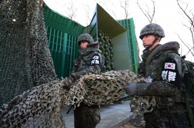 A South Korean soldier stands near the loudspeakers near the border area between South Korea and North Korea in Yeoncheon South Korea Friday Jan. 8 2016. South Korea responded to North Korea's nuclear test with broadcasts of anti Pyongyang propaga