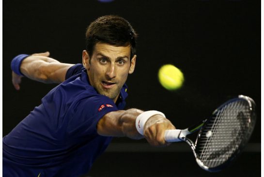 Novak Djokovic stretches to hit a shot during his second round match against Quentin Halys at the Australian Open tennis tournament at Melbourne Park Australia on Thursday