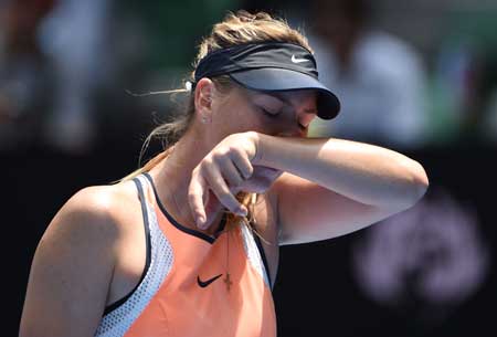 Russia’s Maria Sharapova gestures during her women’s singles match against Serena Williams of the US on day nine of the 2016 Australian Open tennis tournament in Melbourne on Tuesday. AFP