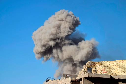 Smoke rises from Islamic State positions following a U.S.-led coalition airstrike as Iraqi Security forces enter downtown Ramadi