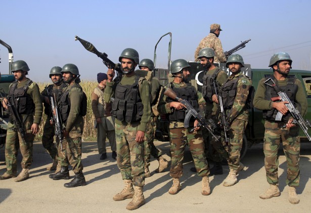 Soldiers gather outside Bacha Khan University the site of a deadly attack