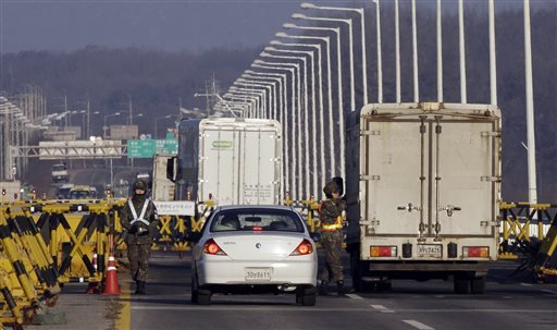 South Korean army soldiers check drivers identities at a check point at Unification Bridge in Paju South Korea near the border village of Panmunjom Friday Jan. 8 2016. South Korea is set to start broadcasting anti Pyongyang propaganda across the bord