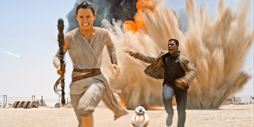 Rey and Finn running away from an explosion