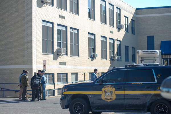 State police and K9 units after the building was searched