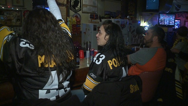 Fans watch the AFC Playoff game between the Steelers and the Bengals