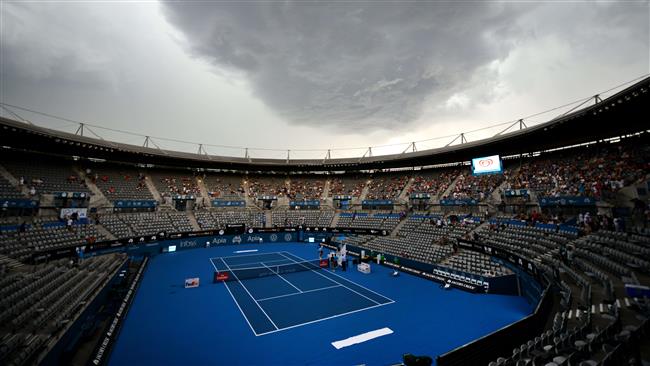 Storm clouds gather over centre court as play is suspended during the Sydney International tennis tournament in Sydney