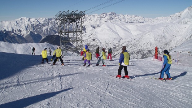 A ski school goes down a slope at Les Deux Alpes in the French Alps. An avalanche hit a group of school children on the black-rated Bellecombe piste on Wednesday killing a 14-year-old student