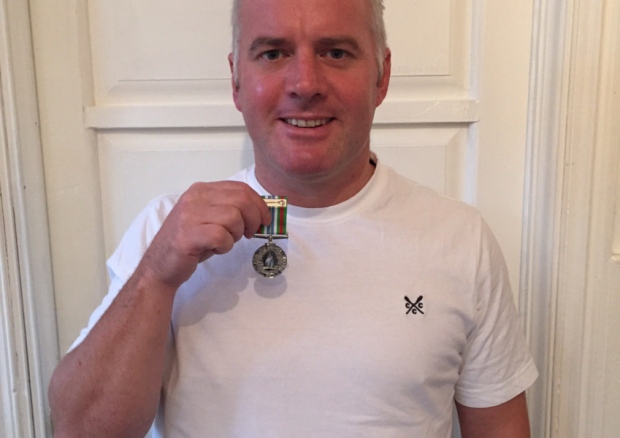 Mal Robinson with his Ebola medal