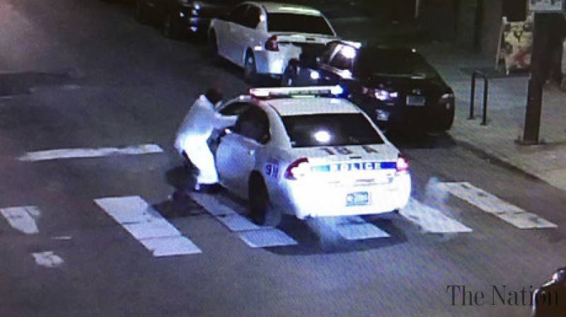 Philadelphia police: Officer shot while in police cruiser