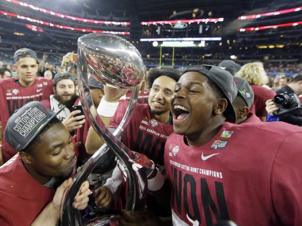 Alabama players celebrate after the Cotton Bowl NCAA college football semifinal playoff game against Michigan State Thursday Dec. 31 2015 in Arlington Texas. Alabama won 38-0 to advance to the championship game