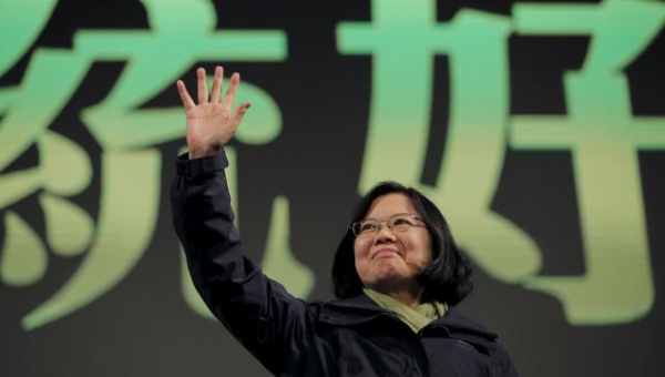 Democratic Progressive Party Chairperson and presidential candidate Tsai Ing-wen waves to her supporters after her election victory in Taipei Taiwan Jan. 16 2016