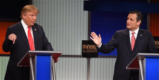 Republican presidential candidate businessman Donald Trump left speaks as Republican presidential candidate Sen. Ted Cruz R-Texas speaks during the Fox Business Network Republican presidential debate at the North Charleston Coliseum Thursday Jan