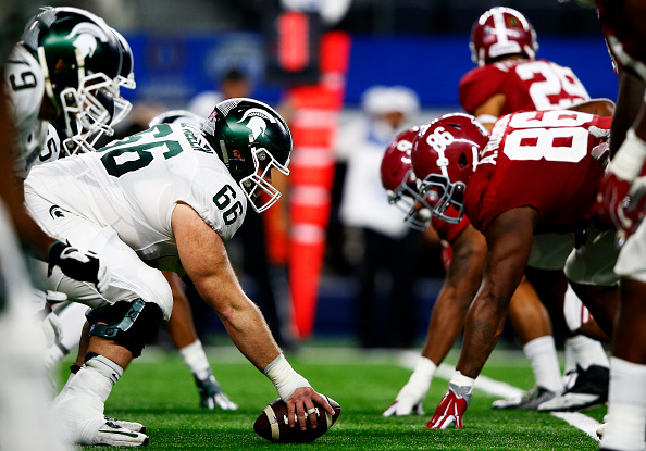 The Michigan State Spartans line up against the Alabama Crimson Tide in the fourth quarter during the Goodyear Cotton Bowl at AT&T Stadium