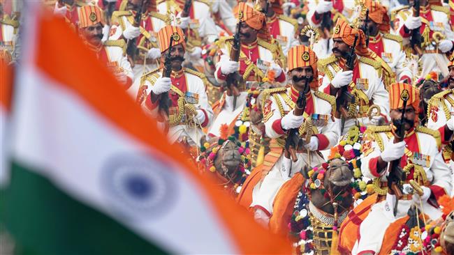 The Indian Border Security Force’s marching contingent rides camels during the Republic Day parade in New Delhi