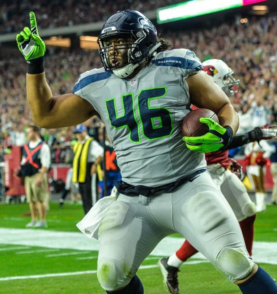 Seattle Seahawks fullback Will Tukuafu from the University of Oregon scores on a 7-yard touchdown catch his first reception of the season in a 36-6 victory Sunday at Arizona