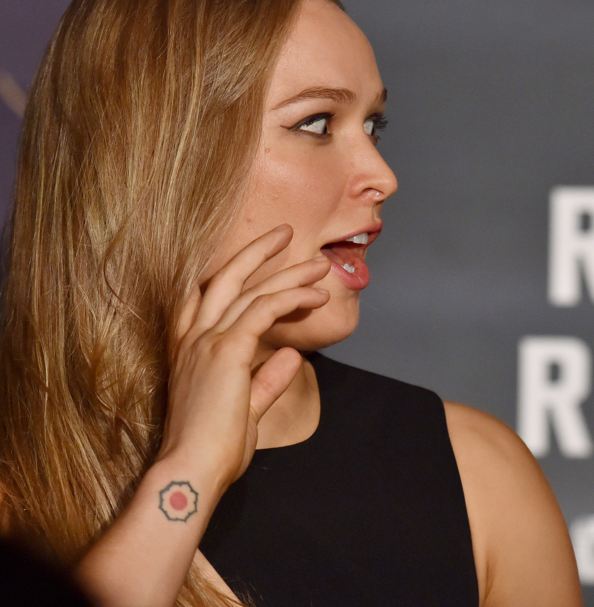 The tattoo on Ronda Rousey’s right wrist matches the tattoo on the unidentified model’s right