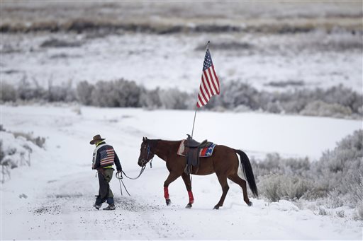 Cowboy Dwane Ehmer of Irrigon Ore. a supporter of the group occupying the Malheur National Wildlife Refuge walks his horse Thursday Jan. 7 2016 near Burns Ore. The group has said repeatedly that local people should control federal lands but criti