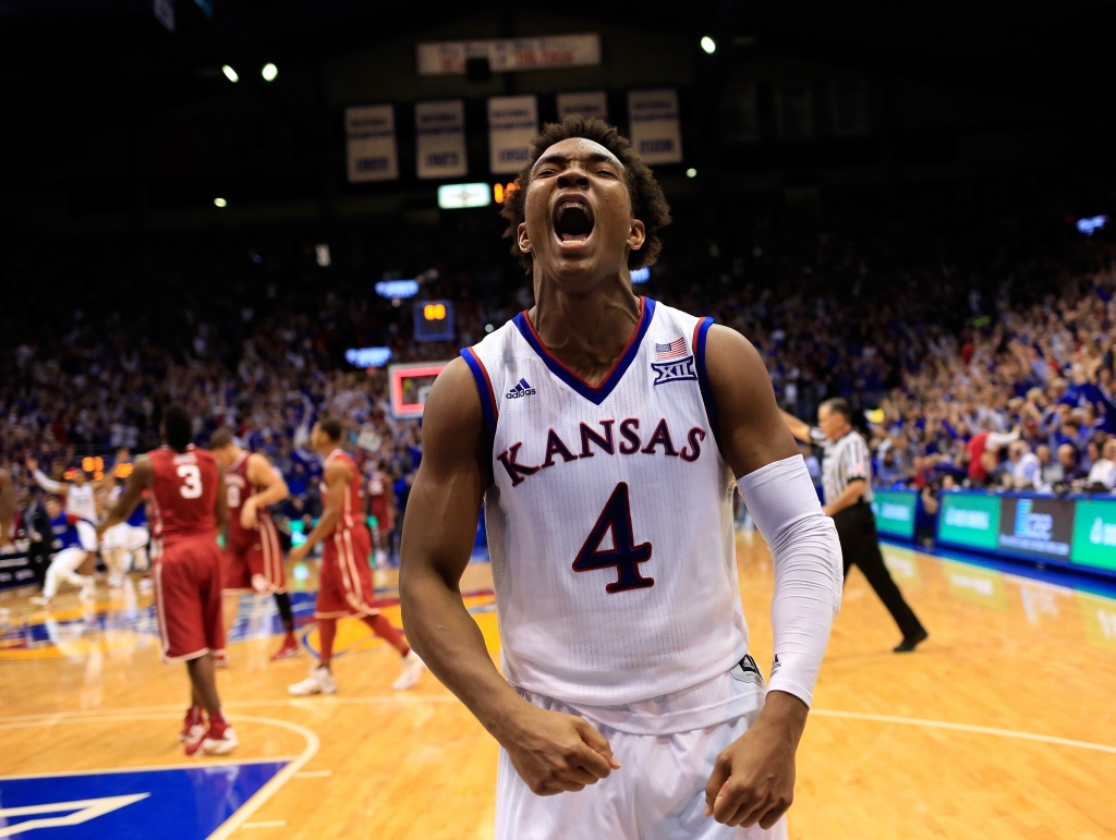 LAWRENCE KS- JANUARY 04 Devonte&#039 Graham #4 of the Kansas Jayhawks celebrates as the Jayhawks defeat the Oklahoma Sooners 109-106 in triple overtime to win the game at Allen Fieldhouse