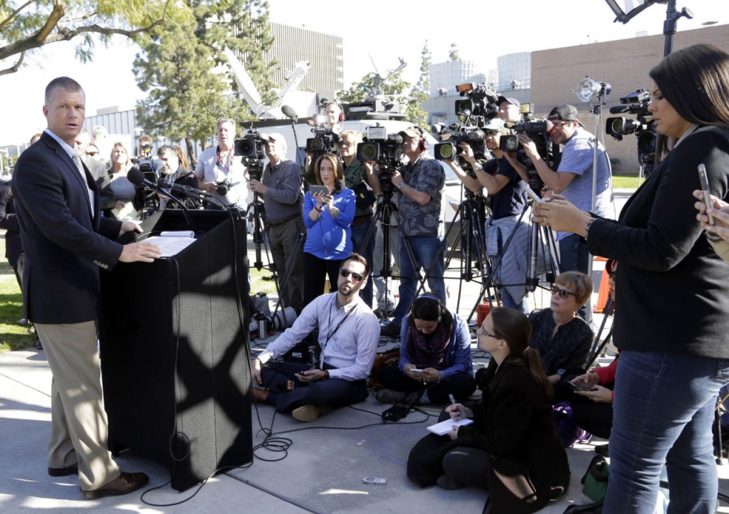 Orange County Sheriff's Department Public Information Officer Lt. Jeff Hallock left takes questions from the media in Santa Ana Calif. on Monday Jan. 25 2016. Three inmates from Orange County Men's Central Jail including a man suspected in a killin