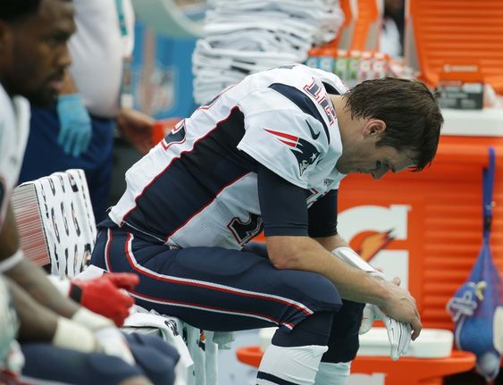 MIAMI GARDENS FL- JANUARY 03 Tom Brady #12 of the New England Patriots looks on during the third quarter of the game against the Miami Dolphins at Sun Life Stadium