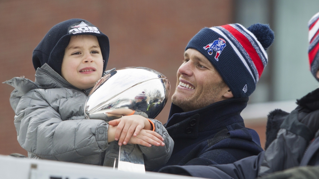 Tom Brady with his youngest son Benjamin during the Patriots&#039 Super Bowl parade in 2015