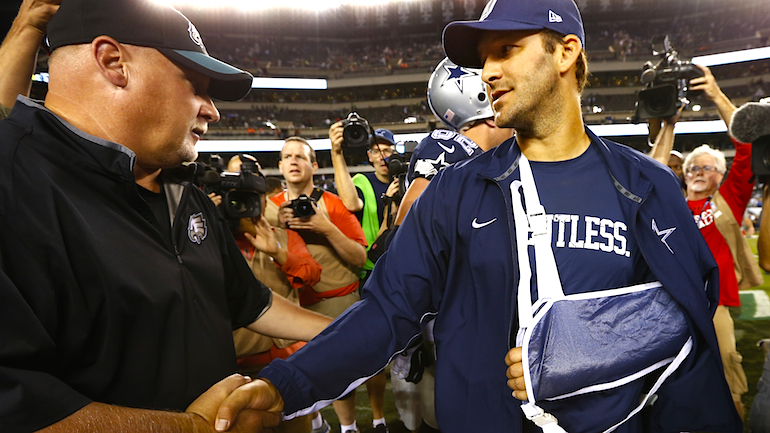 Eagles coach Bill Mc Govern of the Philadelphia Eagles shakes hands with Tony Romo #9 of the Dallas Cowboys after their football game