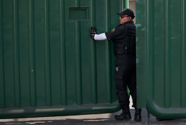 A guard closes the gate at the entrance gate of the Agujas immigration detention center where U.S. fugitive Ethan Couch is being detained in Iztapalapa Me