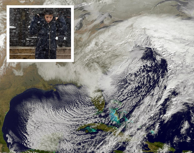 CORRECTS DAY OF WEEK TO SATURDAY NOT THURSDAY- This image taken by NOAA's GOES-East satellite on Saturday Jan. 23 2016 at 9:37 a.m. EST shows a large winter snowstorm over the East Coast of the United States